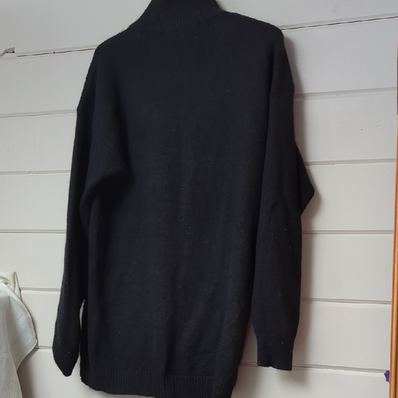 Elegant Black Turtleneck Sweater with Silver Snowflake Design - Picture 2 of 8